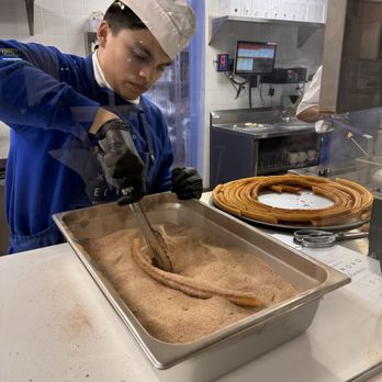 El Moro - Covering the churro in toppings - Desserts Near Me - Los Angeles, California