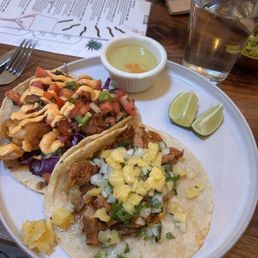 Shrimp and al pastor à la carte tacos.