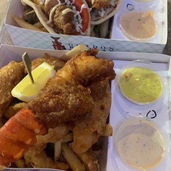 Gordon Ramsay Fish & Chips - Chickenwich with dirty #1 fries (back) and fish, shrimp and lobster with dirty #3 fries (front) - Fish & Chips Near Me - Orlando, Florida Gordon Ramsay Fish & Chips - Chickenwich with dirty #1 fries (back) and fish, shrimp and lobster with dirty #3 fries (front) - Fish & Chips Near Me - Orlando, Florida
