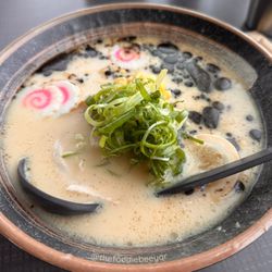 Tipsy Samurai - 20oz ramen with Tonkotsu Pork broth, garlic oil, 2 pieces of pork, marinated egg, buttered corn, naruto fish cakes and green onion