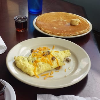 Cafe Cappuccino - Sausage and cheddar omelette that comes with a pancake - Breakfast & Brunch Near Me - Waco, Texas Cafe Cappuccino - Sausage and cheddar omelette that comes with a pancake - Breakfast & Brunch Near Me - Waco, Texas