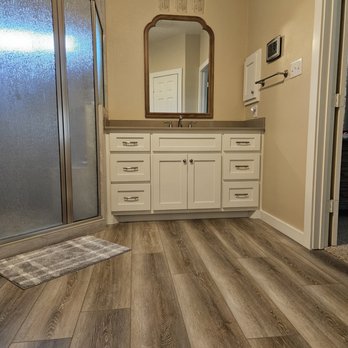 YourNextPainter & Remodeling - NEW: Floors, cabinets, tops, baseboards, and door casing, along with a whole new shower with rain pattern glass! - Painters Near Me