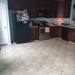 Carpet World - BEFORE! Check out the hideous flooring and white trim that doesn't match cupboard baseboards.