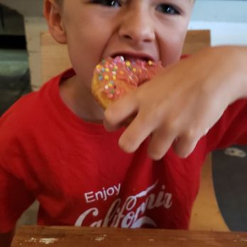 Lola Coffee - My nephew enjoying his donut oblivious to customer glares!!! - Coffee & Tea Near Me - Phoenix, Arizona Lola Coffee - My nephew enjoying his donut oblivious to customer glares!!! - Coffee & Tea Near Me - Phoenix, Arizona