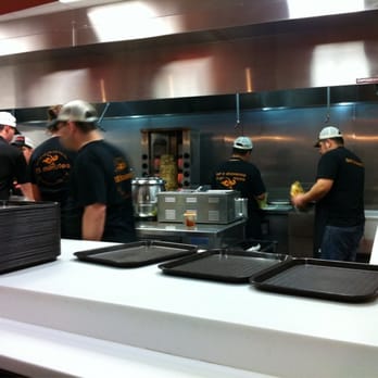 Naf Naf Grill - Waiting for food. Chicken shaver in the background. - Middle Eastern Near Me - Naperville, Illinois