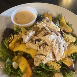Buffalo chicken sandwich and Peach salad. Buffalo chicken sandwich and Peach salad.