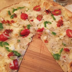 Beerliner German Bar and Restaurant - Flatbread pizza with mozzarella, cherry tomatoes, onion and pesto