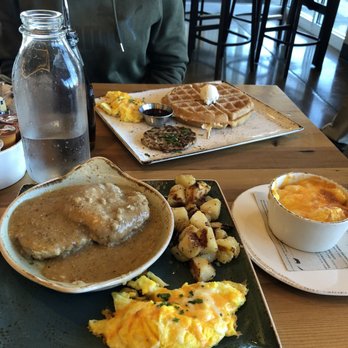 First Watch - Turkey sausage gravy with scrambled eggs and cheese and grits. The gravy is good has nice spice to it biscuits nice and fluffy - American Near Me - Knoxville, Tennessee