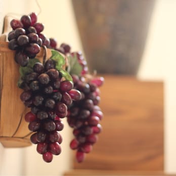 Naumann Vineyards - a bunch of grapes hanging on a wall - Wineries Near Me - Cupertino, California Naumann Vineyards - a bunch of grapes hanging on a wall - Wineries Near Me - Cupertino, California