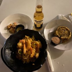 Pura Vida - Mahi bites, traditional seafood paella and traditional mofongo