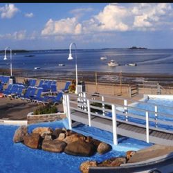 Westchester Country Club - WCC Beach Club Pool as the club opens. Long Island Sound , and Captain's Island in the background