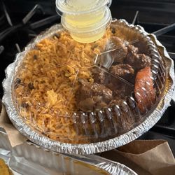 Pito's Restaurant - Stewed Beef (Res Guisado) and Yellow Rice (Moro De Gandules) w/my fave Wasakaka (citrusy Garlic Sauce).