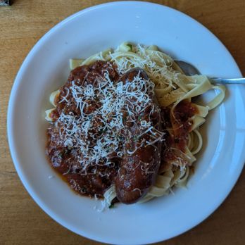 Olive Garden Italian Restaurant - Italian sausage with meat sauce over fettuccine - Italian Near Me - Turlock, California Olive Garden Italian Restaurant - Italian sausage with meat sauce over fettuccine - Italian Near Me - Turlock, California