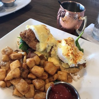 Baker's Crust Artisan Kitchen - Swanky Benedict. Fried chicken, bacon, egg, spinach on sweet potato biscuits. Oh and that pear mule. - Breakfast & Brunch Near Me - Ashburn, Virginia Baker's Crust Artisan Kitchen - Swanky Benedict. Fried chicken, bacon, egg, spinach on sweet potato biscuits. Oh and that pear mule. - Breakfast & Brunch Near Me - Ashburn, Virginia