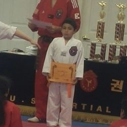 US Martial Arts Academy - This is me when I was younger and had gotten my orange belt that's when I fell in love with karate thanks to my master