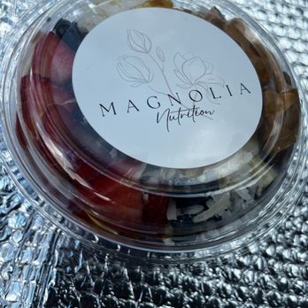 Magnolia Nutrition - a container of fruit on a table - Juice Bars & Smoothies Near Me - Gonzales, Louisiana Magnolia Nutrition - a container of fruit on a table - Juice Bars & Smoothies Near Me - Gonzales, Louisiana
