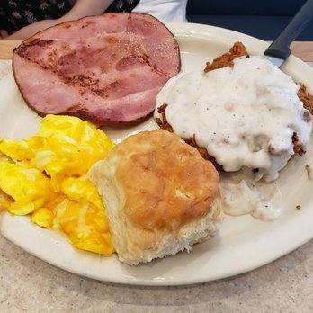 Ronnie's Restaurant - Chicken fried chicken with scrambled cheese eggs, ham and a biscuit. - Breakfast & Brunch Near Me - Lenexa, Kansas