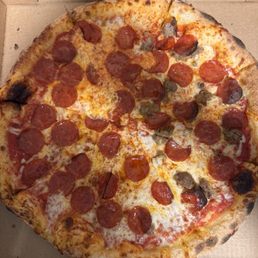 All pepperoni and half with sausage pizza. All pepperoni and half with sausage pizza.