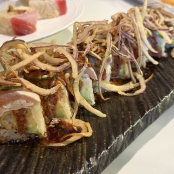 Yuzu Laguna Beach - Monster Roll Rich flavors (Lightly coated onions on top of a decadent delicious roll with more tempura inside, sweet creamy layers) - Sushi Bars Near Me - Laguna Beach, California Yuzu Laguna Beach - Monster Roll Rich flavors (Lightly coated onions on top of a decadent delicious roll with more tempura inside, sweet creamy layers) - Sushi Bars Near Me - Laguna Beach, California