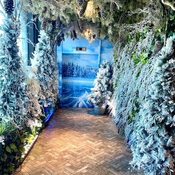Juniper - The walkway to the elevator decorated for winter. - New American Near Me - Greenville, South Carolina