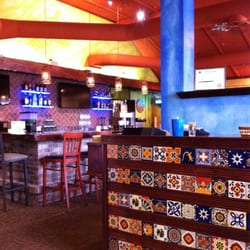 Casa Azul - Host table when you walk in and the bar.