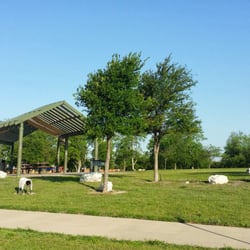 Park with benches and small grills along the trail