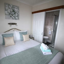 Orasay B&B - Double Bedroom. Clean, but tiny. The sliding door to the bathroom offers a poor soundproofing. (Courtesy of their website)