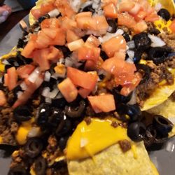 Triangle Bowl - Amazing and large nachos. A little spicy and delicious