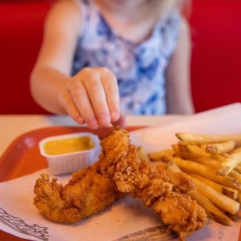 Hardee's - a little girl eating chicken and fries - Burgers Near Me - Carthage, North Carolina Hardee's - a little girl eating chicken and fries - Burgers Near Me - Carthage, North Carolina