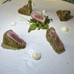 La Bettola del Pescatore - Tuna 450 Celsius Yellowfin Tuna with Bronte Pistachio, available only in blood Seared at 450° on Oak Embers, seasoned with evo oil