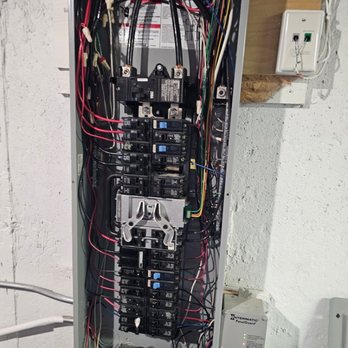 Power Driven - Replacing bad power surge protection device on panel - Electricians Near Me Power Driven - Replacing bad power surge protection device on panel - Electricians Near Me