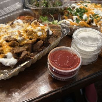 Shawarma Express Glisan - Just some of our food, with the tri-meat platter on the left and the tri-meat fries on the right, plus all the sauces they gave us! - Halal Near Me - Portland, Oregon Shawarma Express Glisan - Just some of our food, with the tri-meat platter on the left and the tri-meat fries on the right, plus all the sauces they gave us! - Halal Near Me - Portland, Oregon