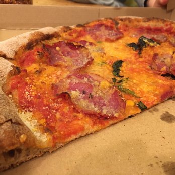 Bellegarde Bakery - a half eaten pizza in a box - Bakeries Near Me - New Orleans, Louisiana