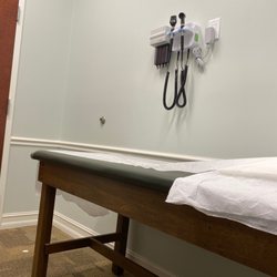 MD Now Urgent Care - Exam bed, outlet, wall etc.