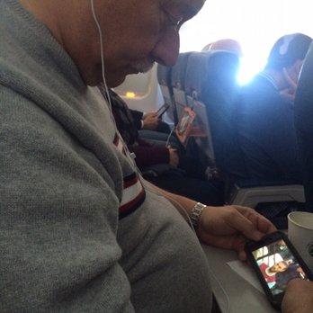 Delta Airlines - This Gent..Hoping 4 A No Neck Pain,Why does his elbow Hurt?Lady Across?The Proud pasengr Who Got The Hefty CarryOn In. - Airlines Near Me - Omaha, Nebraska
