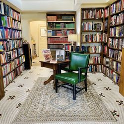 Burrowing Owl Books - Two chairs among bookshelves