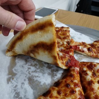 Sako's Pizza - Underbelly of a small cheese pizza - Pizza Near Me - Cranston, Rhode Island