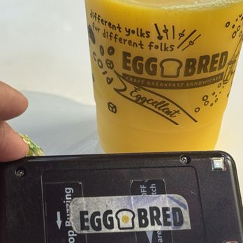 Eggbred - ORANGE JUICE and my buzzer for my food - Breakfast & Brunch Near Me - Long Beach, California Eggbred - ORANGE JUICE and my buzzer for my food - Breakfast & Brunch Near Me - Long Beach, California