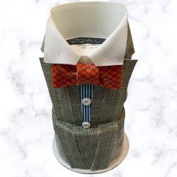 Regency Desserts - Custom Tower Suit Cake. It's dressed to the nines with glen plaid suiting, striped shirt and a lovely bowtie. It's entirely edible.