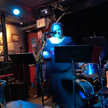 Freddy's Bar - a man playing a saxophone and a woman singing - Music Venues Near Me - Brooklyn, New York