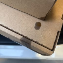 Oil dripping out of the box and on my car seat . Oil dripping out of the box and on my car seat .