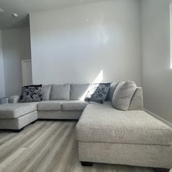 DFW Furniture Warehouse - U shape light gray couch
