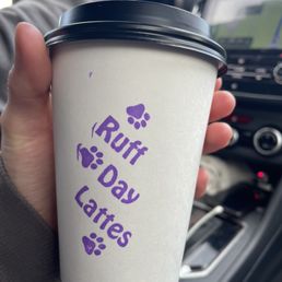 a hand holding a coffee cup a hand holding a coffee cup