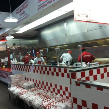 Five Guys - Five guys hard at work, literally! - Burgers Near Me - Redwood City, California