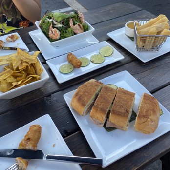 Havana - Plantain Chips (left) / Kale Salad with shrimp (top) / Yucca Fries (right) / Cuban Sandwich (bottom) - Cuban Near Me - Walnut Creek, California Havana - Plantain Chips (left) / Kale Salad with shrimp (top) / Yucca Fries (right) / Cuban Sandwich (bottom) - Cuban Near Me - Walnut Creek, California