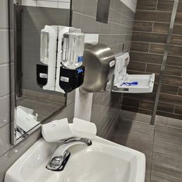 Broken soap dispensers Men Room