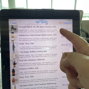 Apropos - a person pointing at a menu on a tablet - American Near Me - Mississauga, Ontario