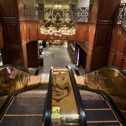 The hotel's beautiful brass escalators.