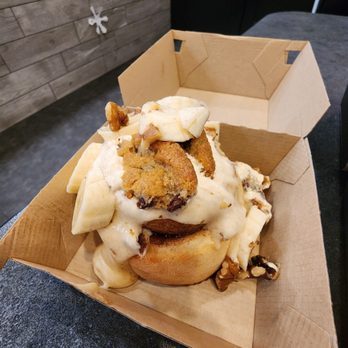 Cinnaholic - Cinnamon roll, cream cheese frosting, cookie pieces, bananas, almonds - Bakeries Near Me - Tampa, Florida Cinnaholic - Cinnamon roll, cream cheese frosting, cookie pieces, bananas, almonds - Bakeries Near Me - Tampa, Florida