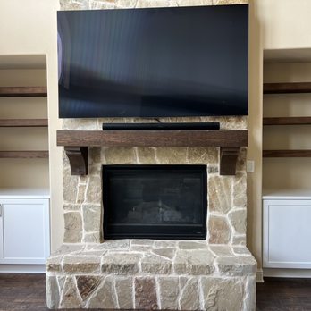 Innovations Touch - Built in cabinets and floating shelves on both sides of fireplace - General Contractors Near Me - Dallas, Texas